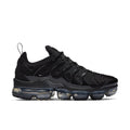 Women's black Air-cushioned sneakers with ribbed side panels and lace-up design.