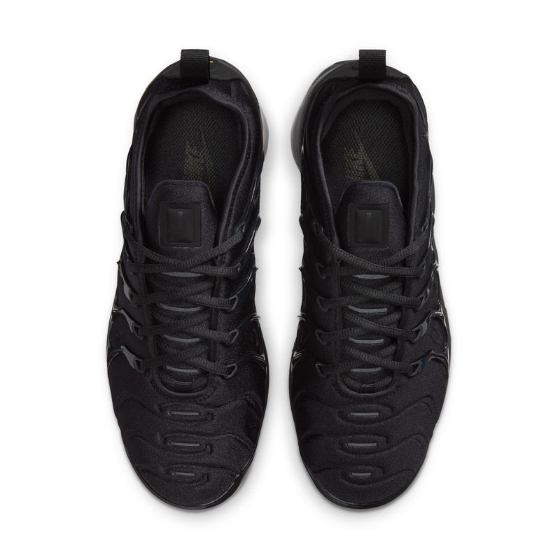 Pair of women's black sneakers, front view with lace-up closure and cushioned tongues.