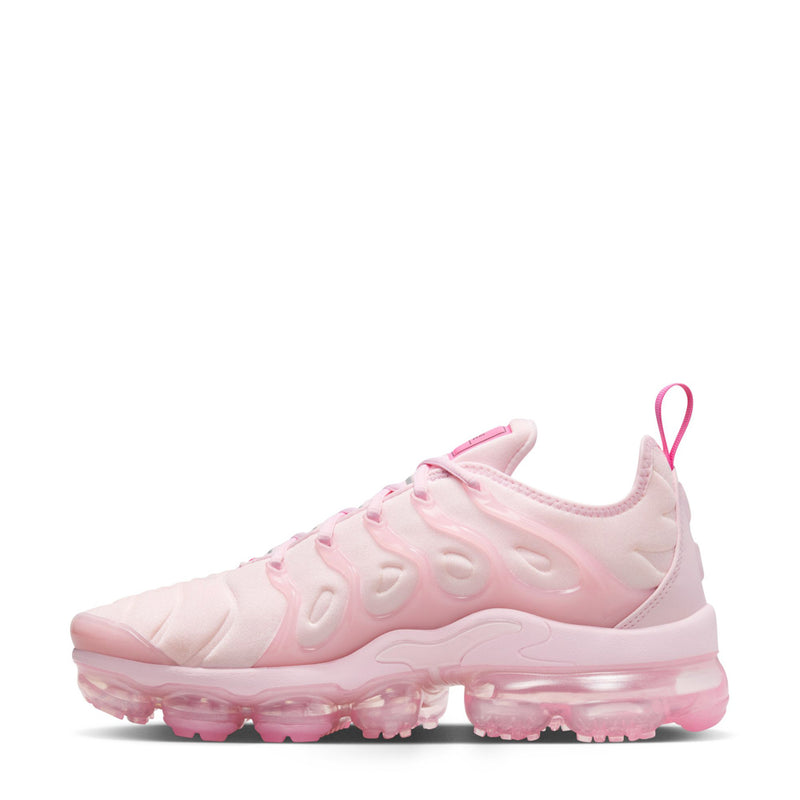 Women’s pink lace-up Nike sneakers with sculpted upper and translucent air outsole
