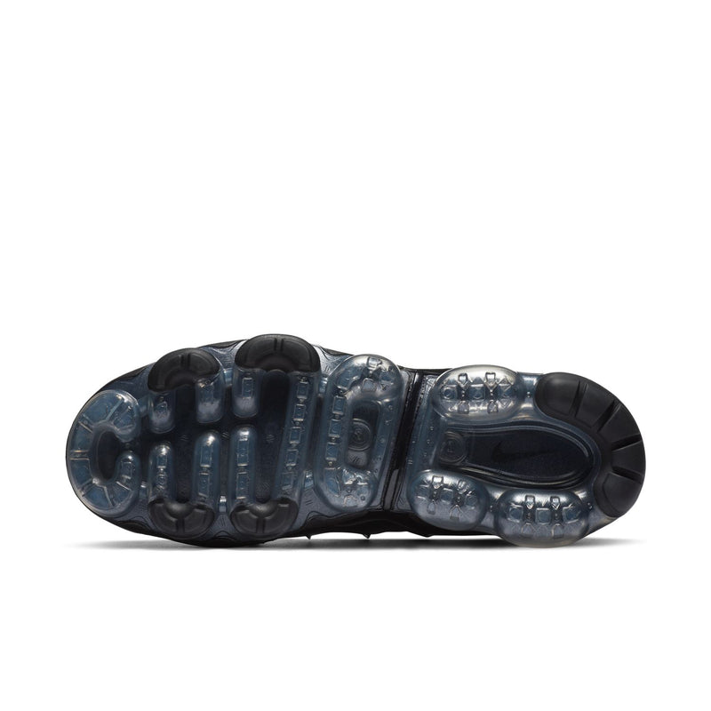 Women's black outsole with visible Air units and tread pattern for traction.