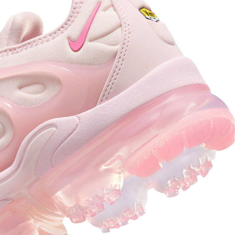 Women’s pink Nike sneakers close-up of midsole cushioning and translucent outsole