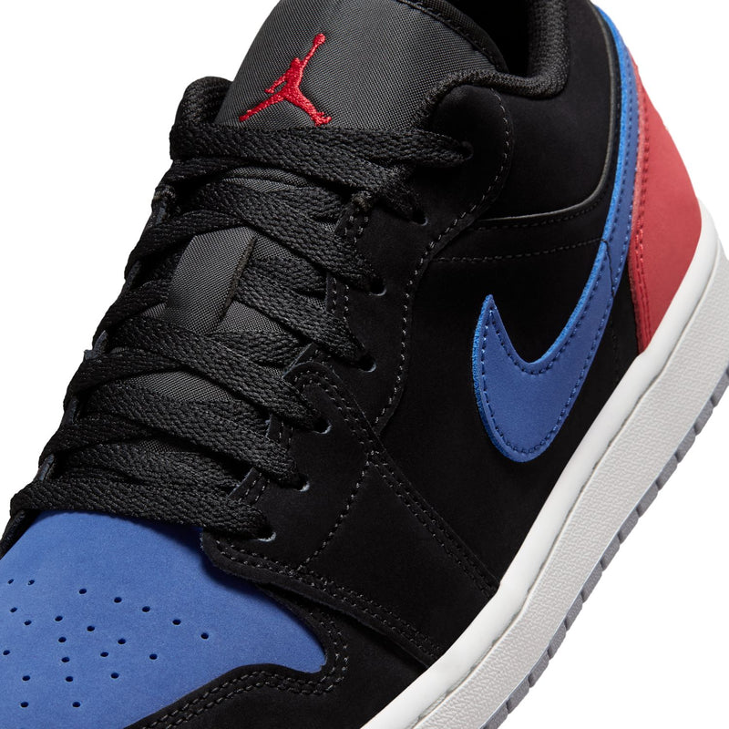 Black lace-up sneaker close-up with blue swoosh and red Jumpman on tongue