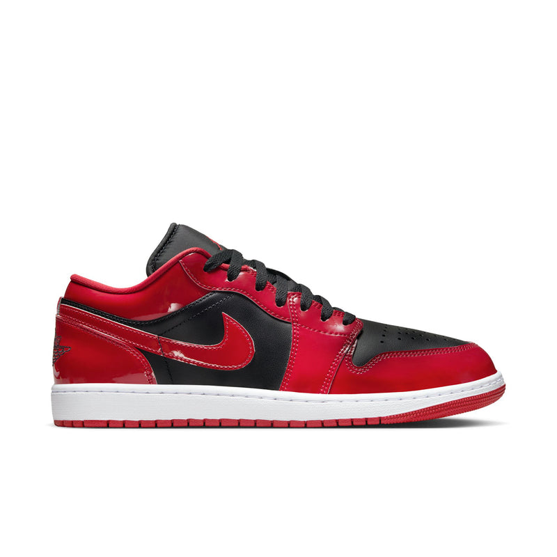 Men's low-top sneakers in red and black with black swoosh and white midsole.