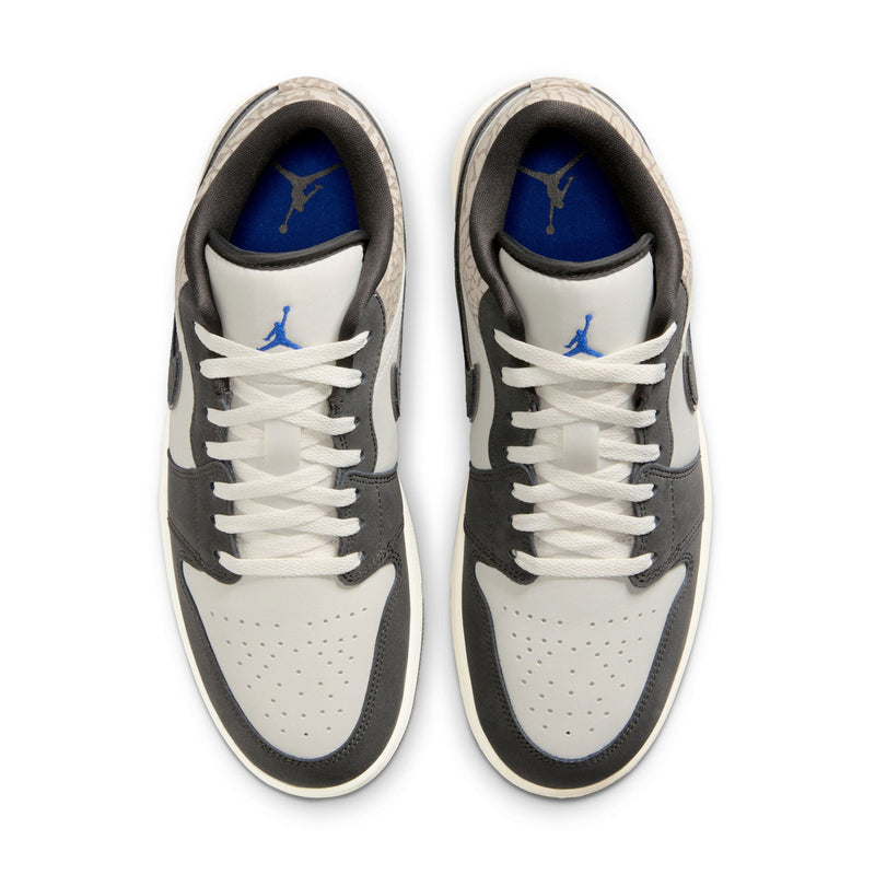 Pair of men's low-top sneakers, black and white uppers with blue logo on tongue