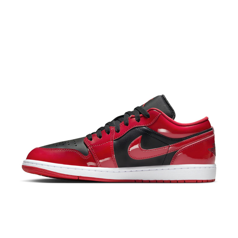 Men's low-top sneakers in red and black with white midsole and black swoosh accent.