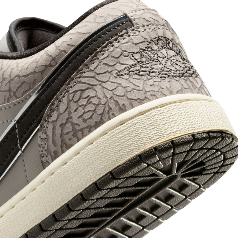 Close-up of men's sneaker sidewall and outsole, light midsole with black tread