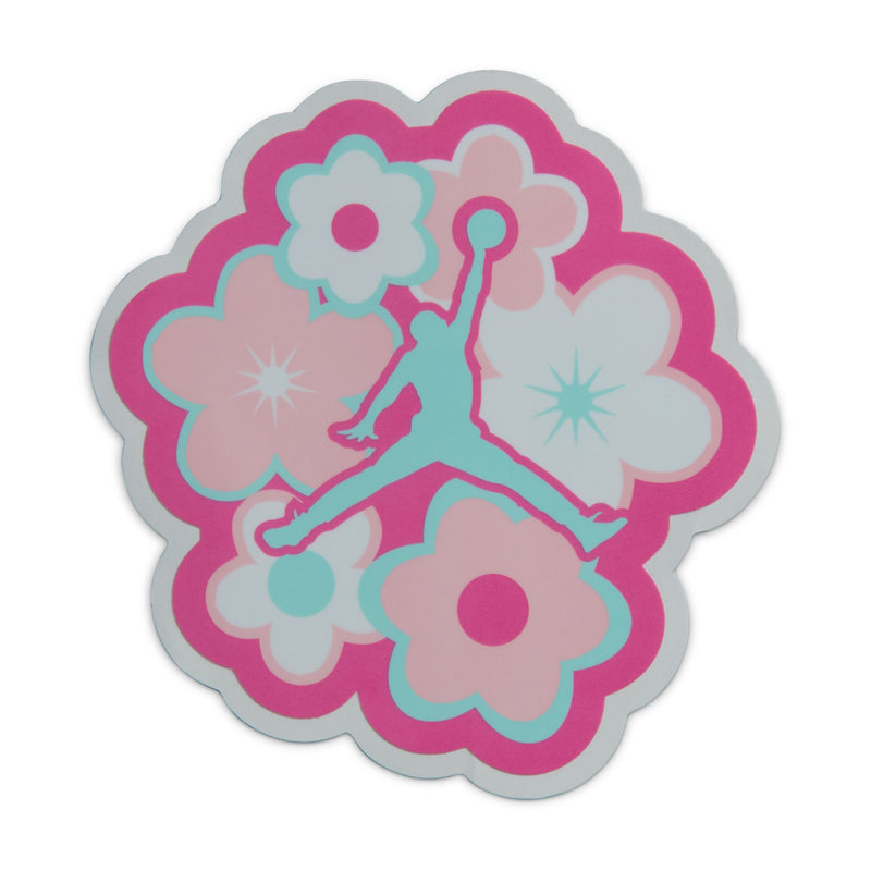 Flower-shaped decorative patch with pink and teal cloud and silhouette designs