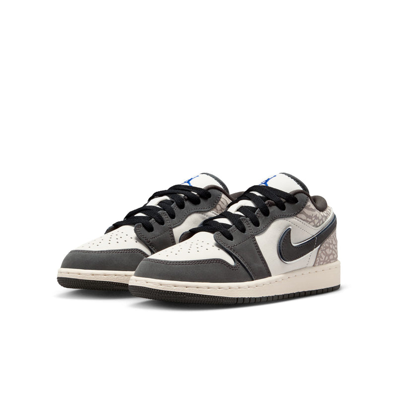 Youth Air Jordan 1 Low SE sneakers, side view; white upper with black swoosh