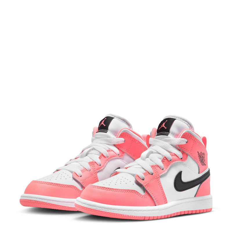 Kids Air Jordan 1 Mid sneakers pair, pink and white with black accents and lace-up tops