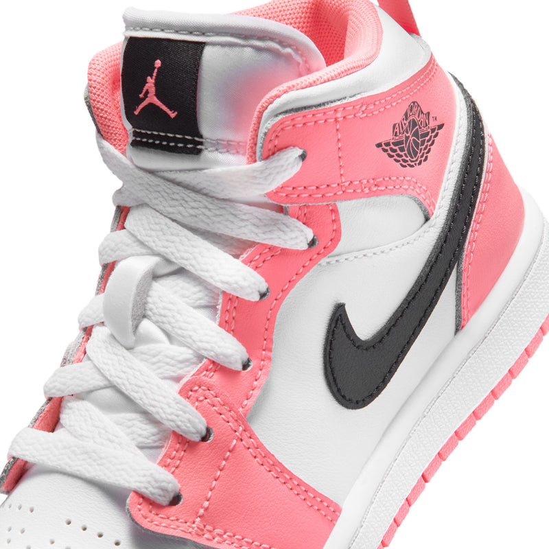 Kids Air Jordan 1 Mid sneaker close-up, white laces, pink/white panels, black swoosh