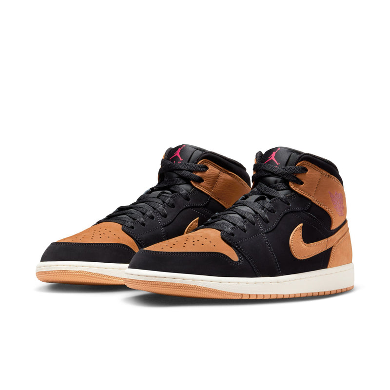 Pair of black and wheat mid-top sneakers with tan swooshes and white sole