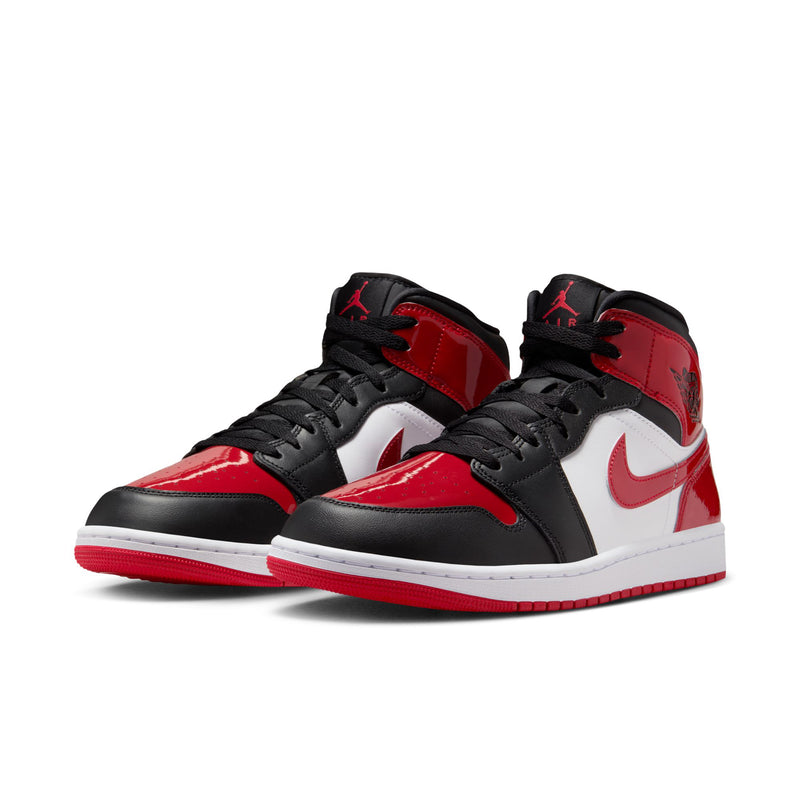 Air Jordan 1 Mid SE pair in black and red with white swoosh and mid-top laces