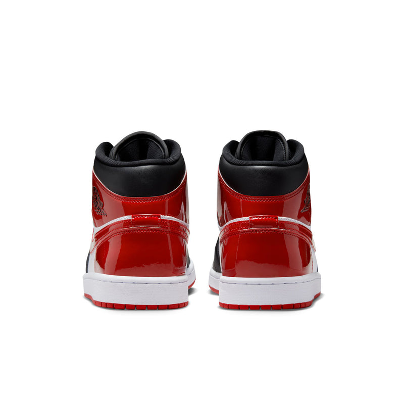 Air Jordan 1 Mid SE sneakers heel view with red patent panels and white midsole