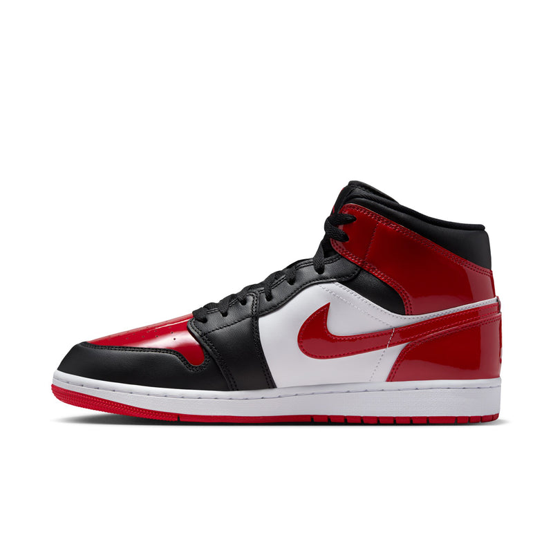Air Jordan 1 Mid SE sneakers side view with white swoosh over black and red uppers