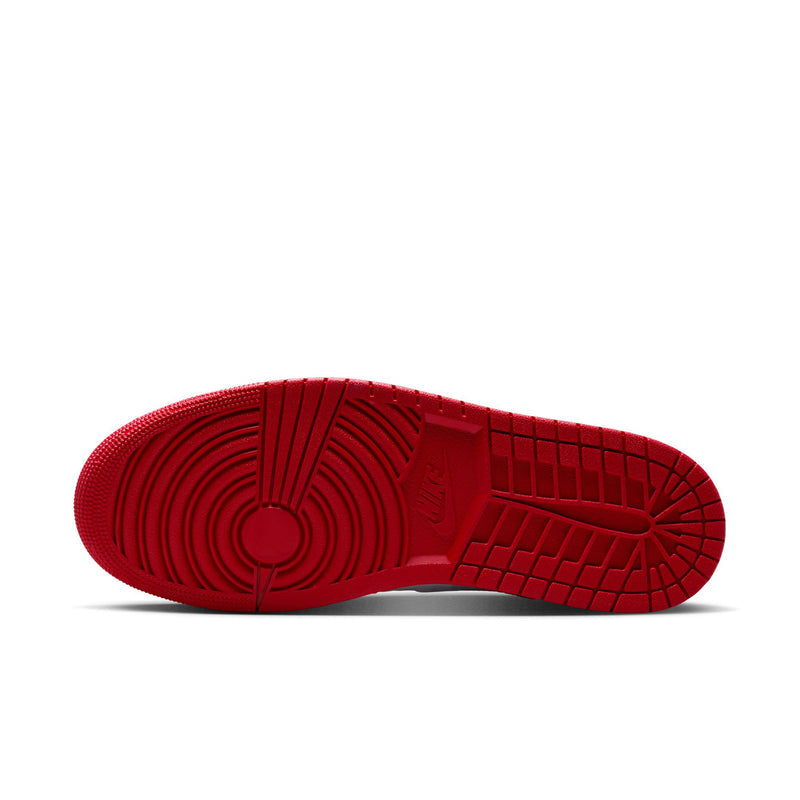 Air Jordan 1 Mid SE outsole with red tread and circular plus grid traction pattern