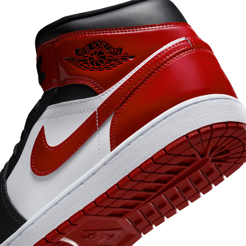 Air Jordan 1 Mid SE close-up of side panel with AIR JORDAN logo and red overlay
