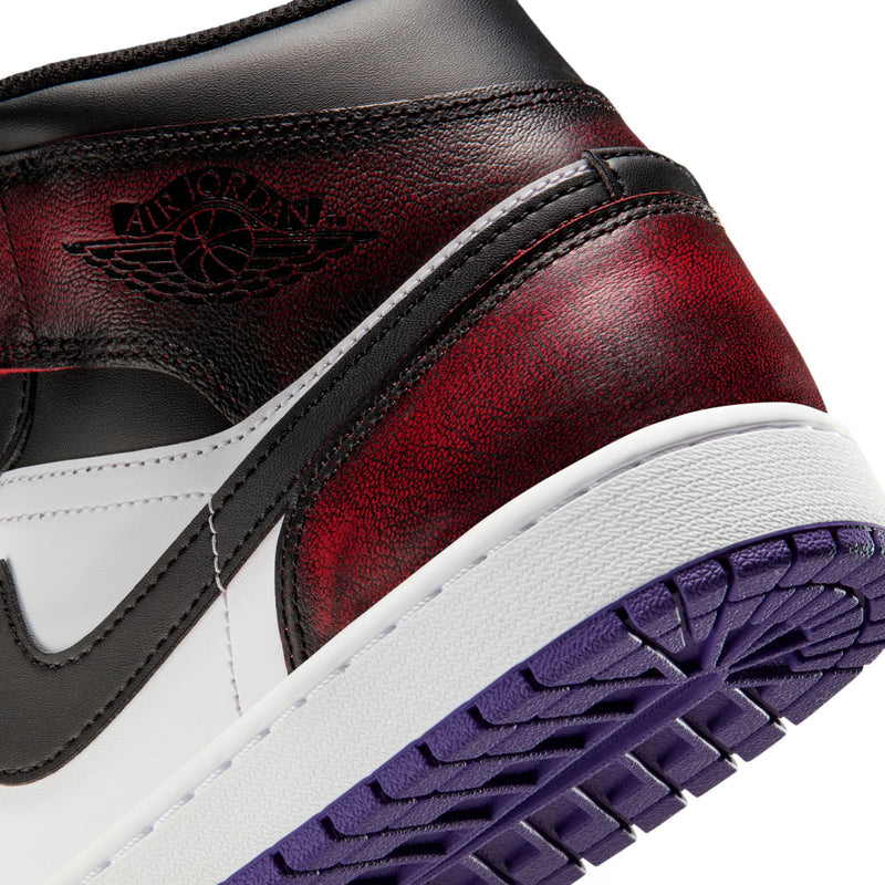 Close-up of side of mid-top sneakers: burgundy-red leather, black swoosh, purple outsole tread