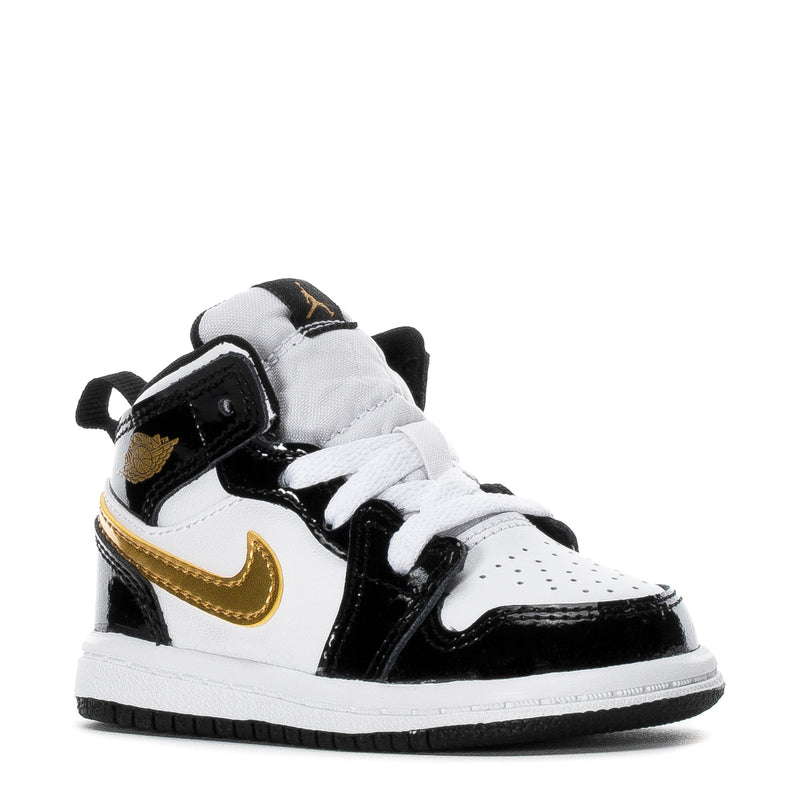 Toddler high-top sneakers, front/side view in black, white, and gold swoosh