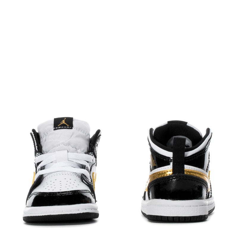 Toddler high-top sneakers, black-and-white rear view with gold trim on collar