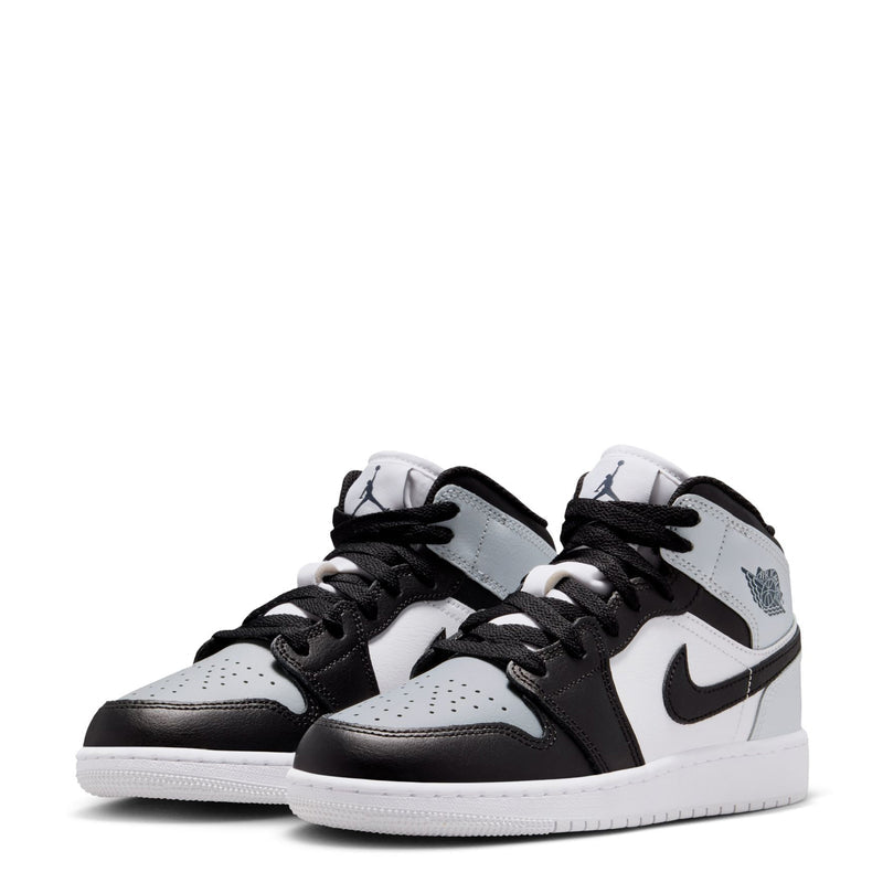 Pair of youth high-top sneakers, white and light gray uppers with black toe and swoosh