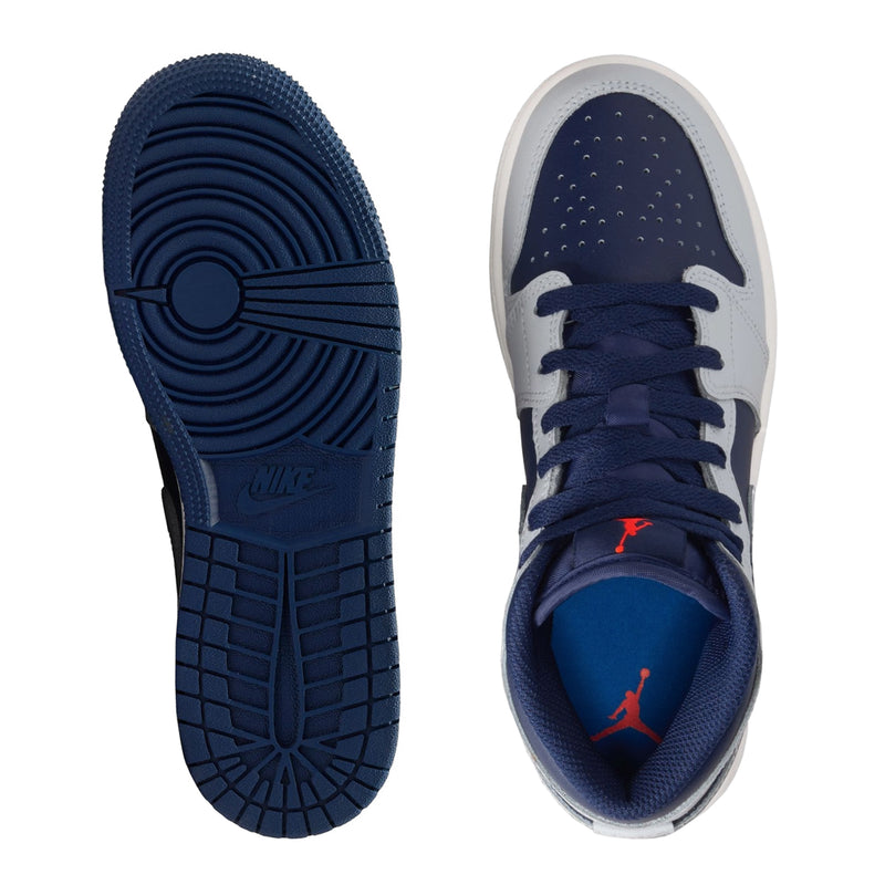 Navy and light gray sneaker soles with tread pattern, pair view