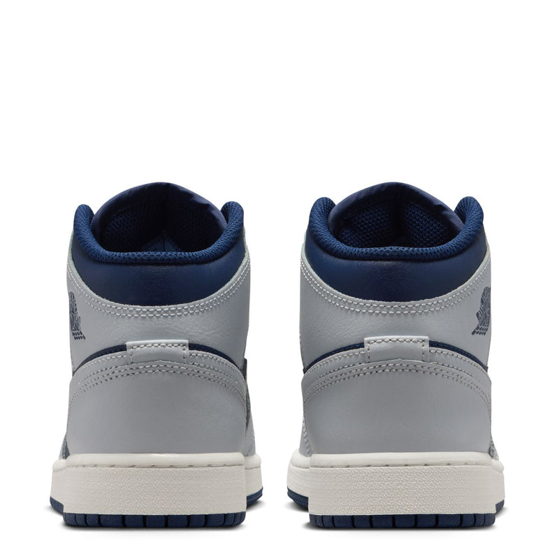Back view of youth mid-top sneakers in light gray with navy collars