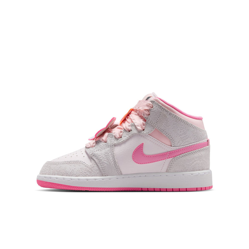 Youth mid-top sneakers, light gray leather with pink swoosh; lace-up front view.