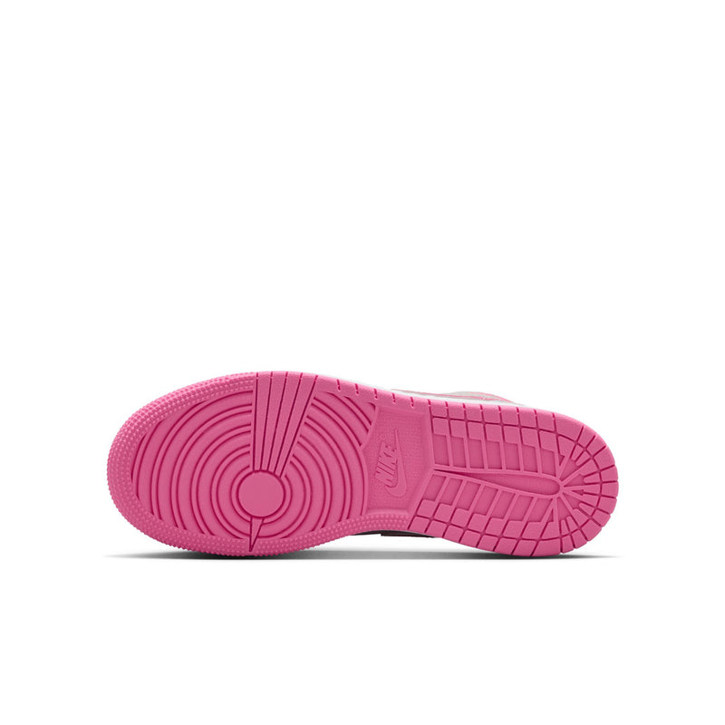 Youth mid-top sneakers outsole view in bright pink with textured traction tread.
