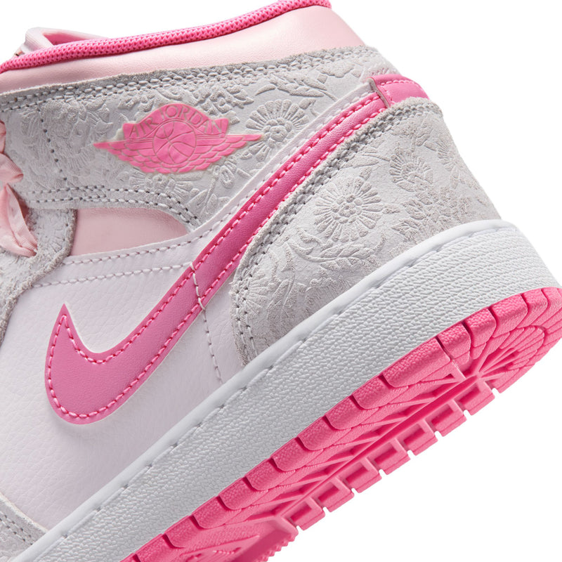 Youth mid-top sneakers side detail: pink swoosh and textured light gray panels with pink trim.