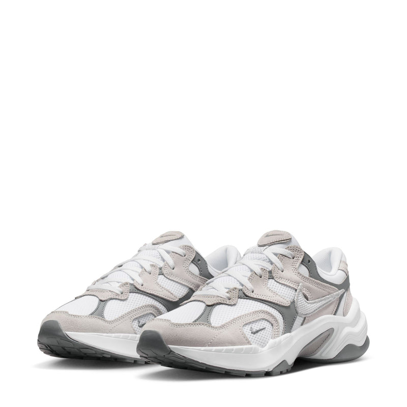 Pair of white, gray, and beige chunky lace-up sneakers with layered overlays