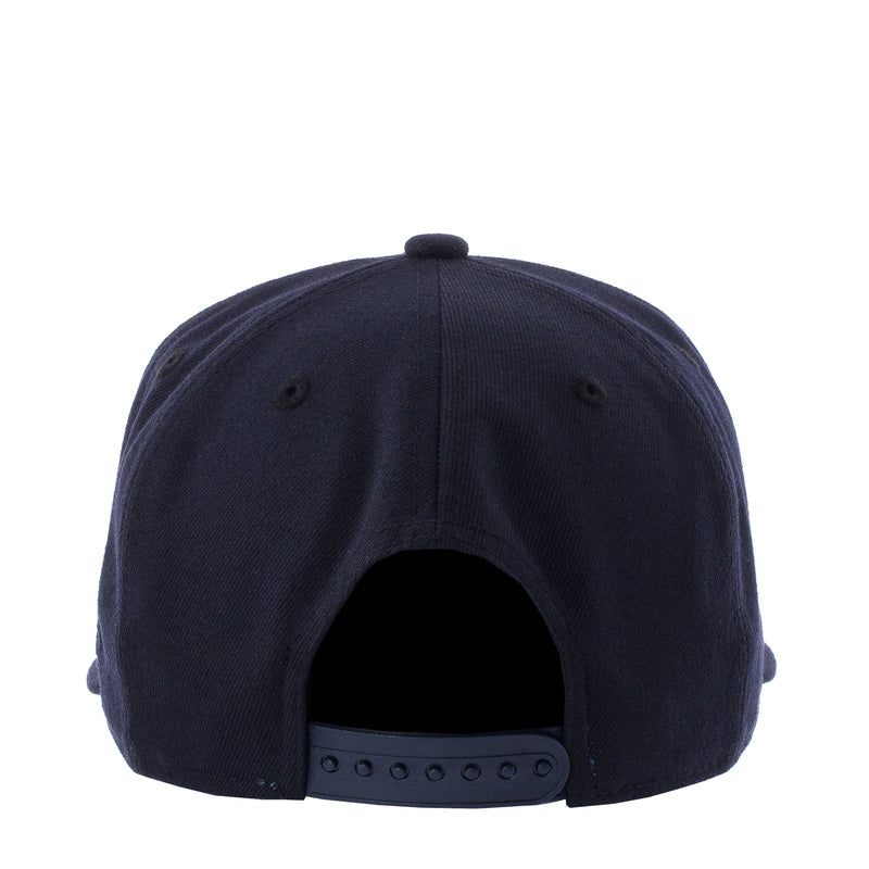 Navy baseball cap back view with adjustable eyelets on strap