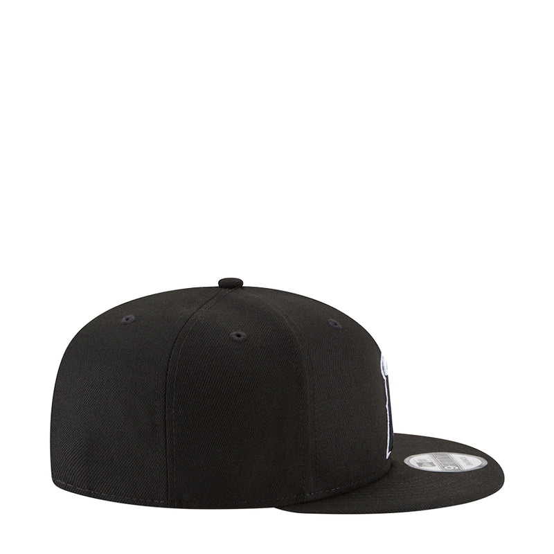 Black baseball cap with white side logo and curved brim