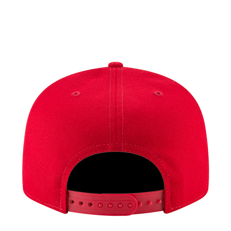 Red baseball cap with black underbrim and stitched crown panels