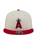 Two-tone baseball cap: white crown, red brim, large red-and-black A logo