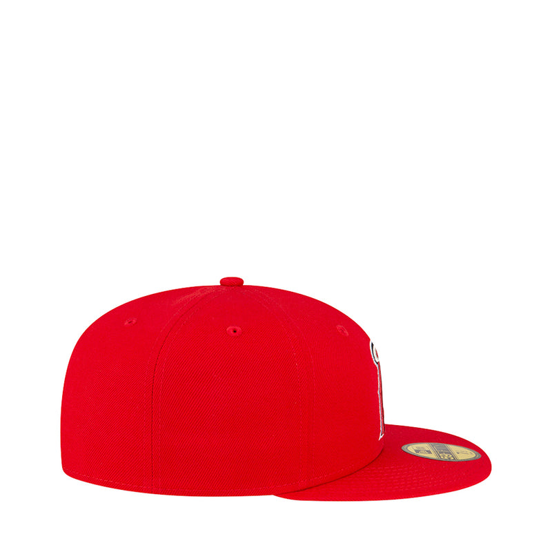 Red baseball cap side view with small brim badge