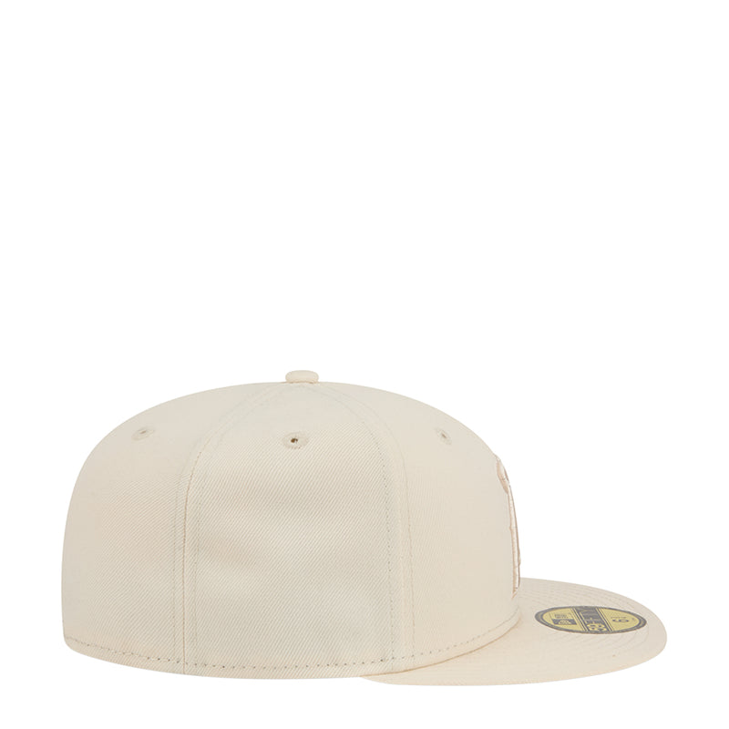 Light cream baseball cap, side view with curved brim and eyelets
