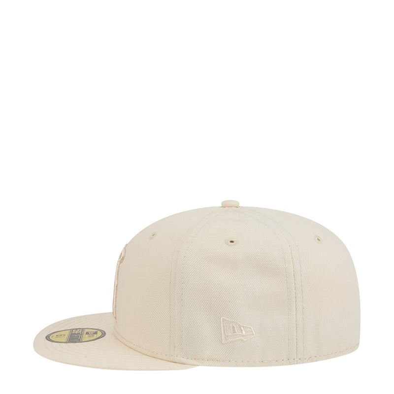 Light cream baseball cap with small monogram logo on front panel