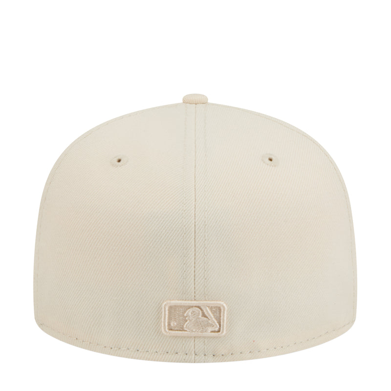Light cream baseball cap with embroidered outline emblem on back