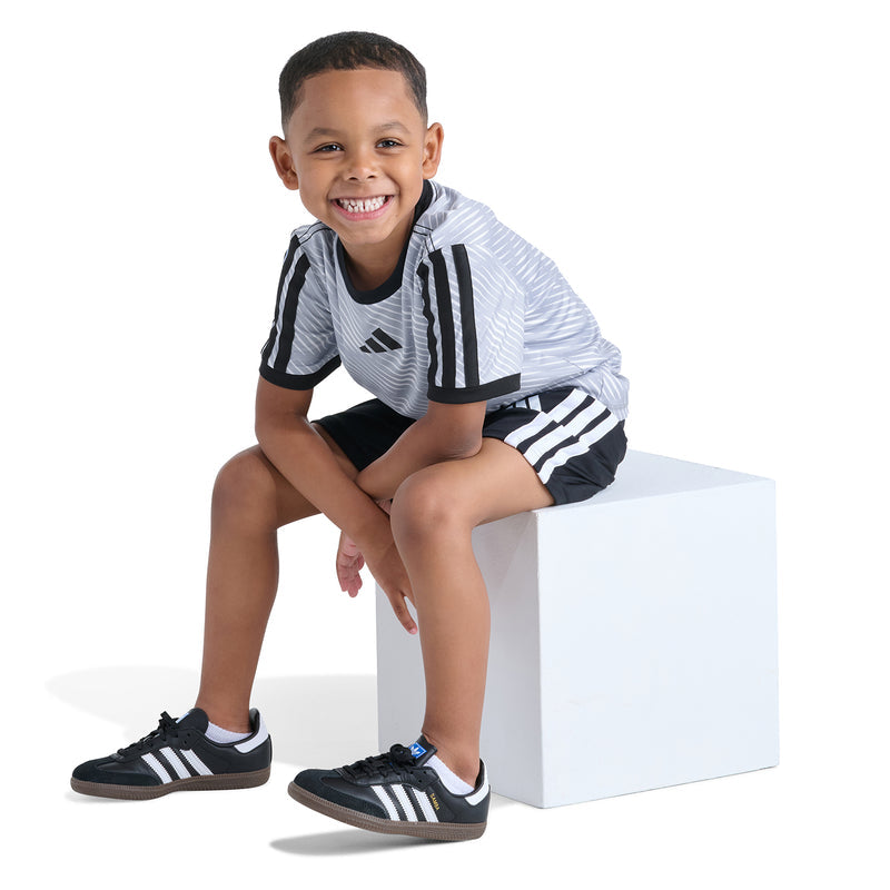 Kids soccer set, front view: light blue jersey with black accents and black shorts