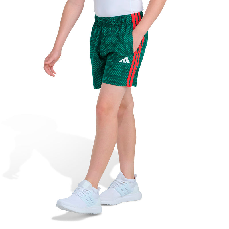 Youth soccer shorts, dark green with elastic waistband and red stripe detail on sides