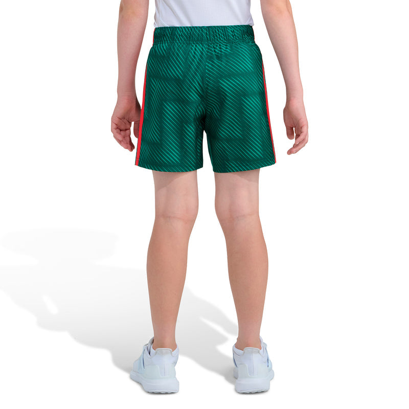 Youth soccer shorts in dark green with subtle pattern texture and red side trim