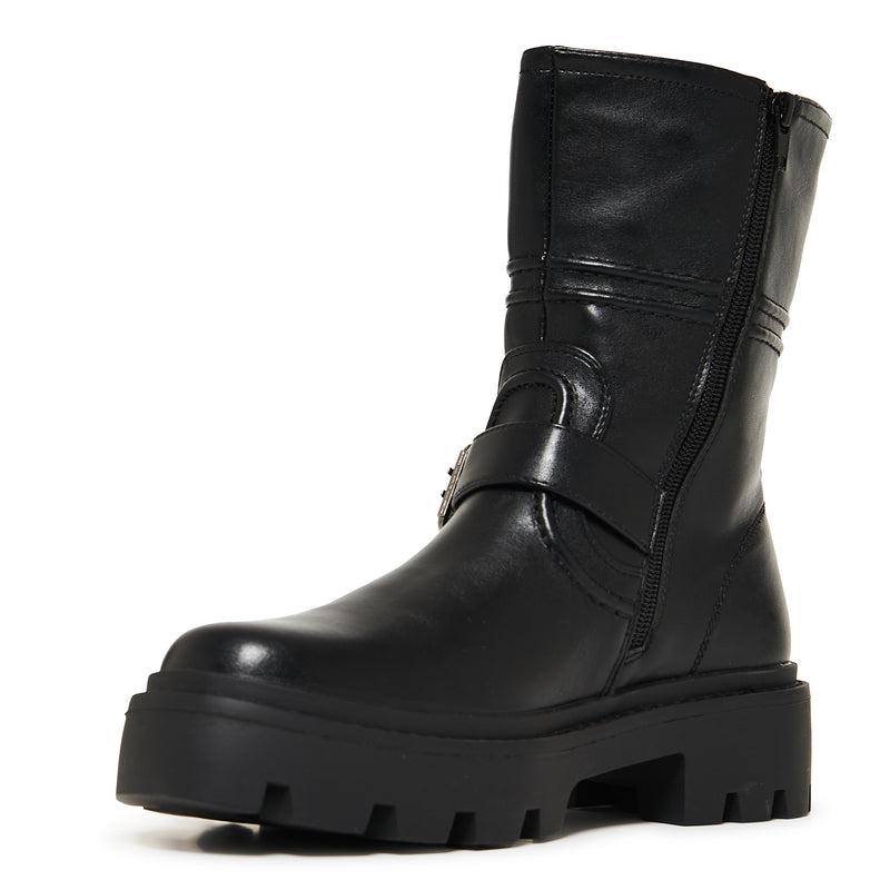 Black leather boot with chunky sole on a white background