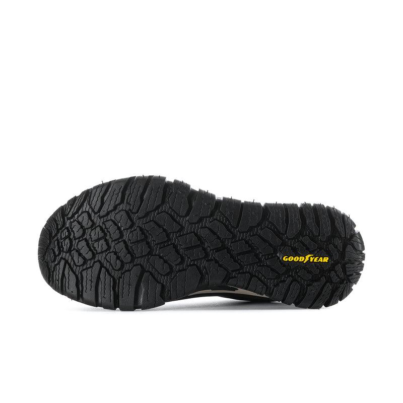 Black outsole of men's comp-toe walking shoes with rugged tread and Goodyear logo