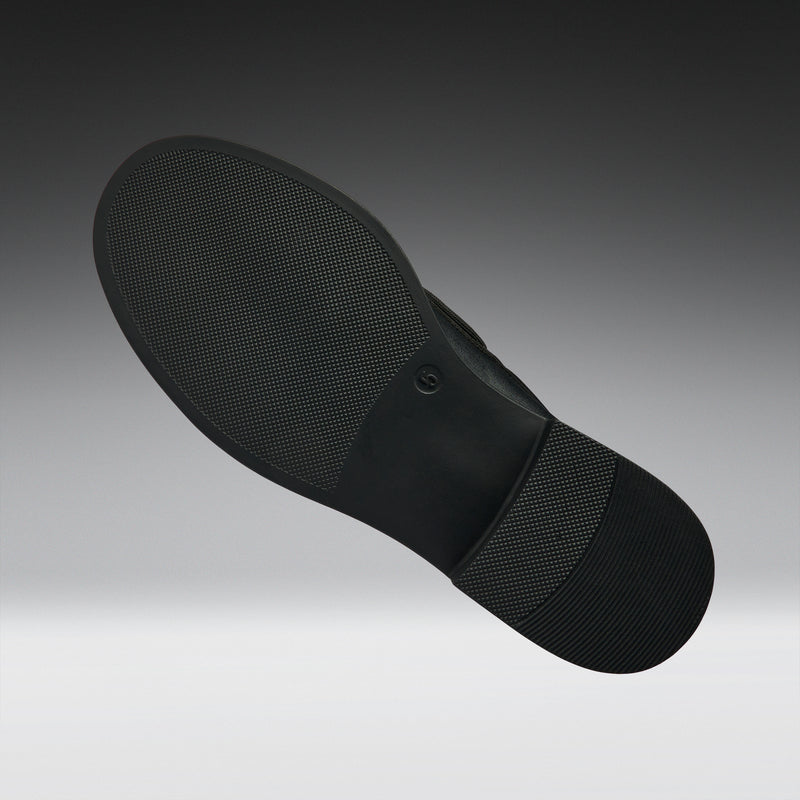 Black shoe sole on a gradient gray background