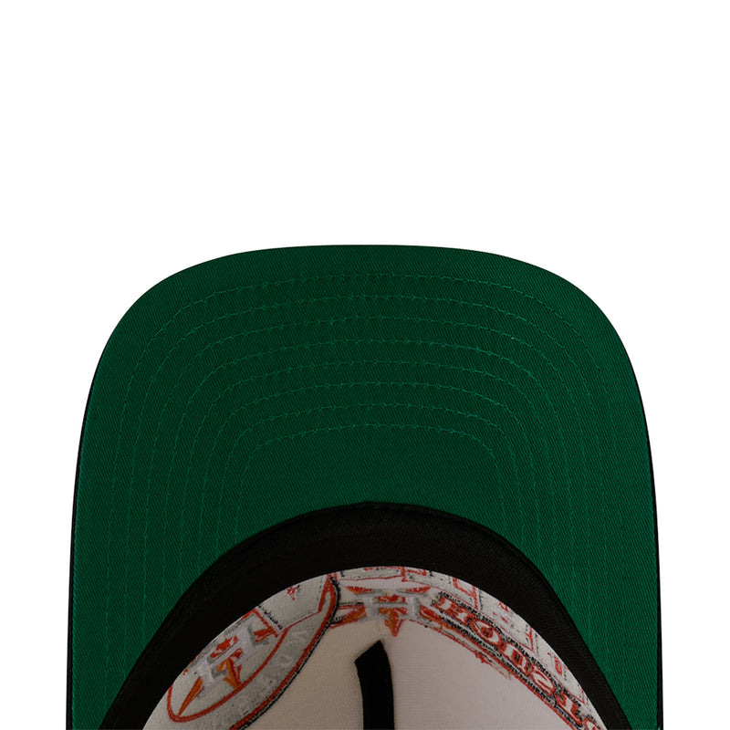 Green baseball cap with dark brim and visible inner hatband