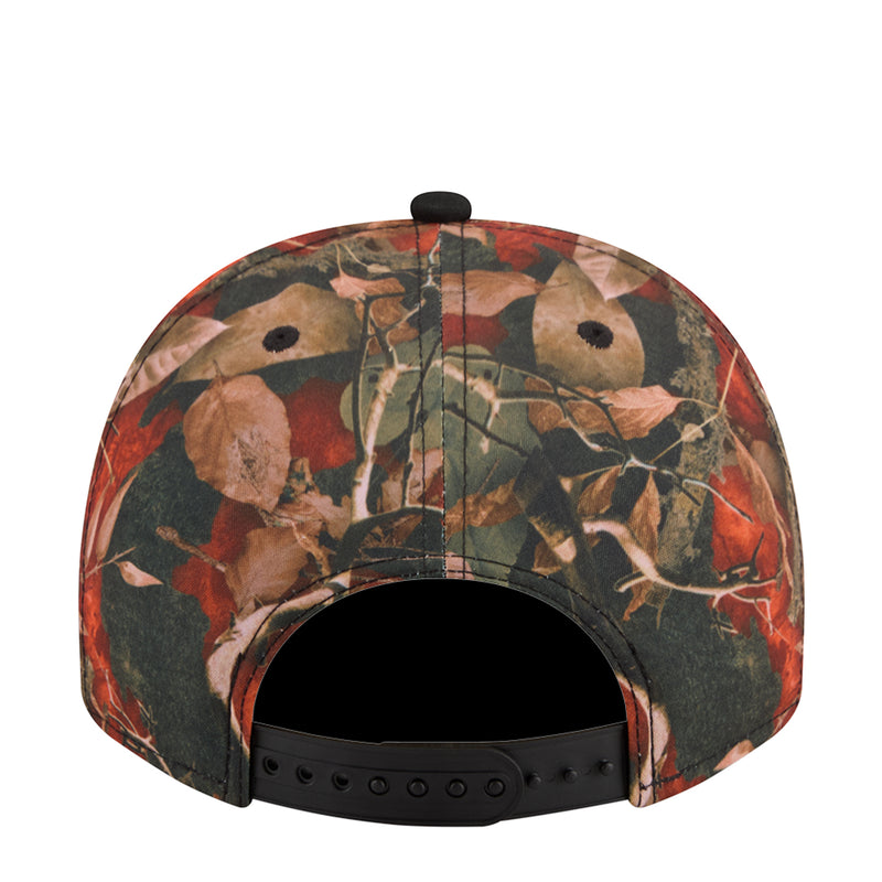 Two-tone baseball cap with orange camo leaf pattern and black adjustable strap; back view
