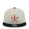 Two-tone baseball cap with orange-and-blue crest on white crown, navy brim
