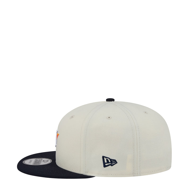 Two-tone baseball cap, white crown with navy New Era logo, navy brim