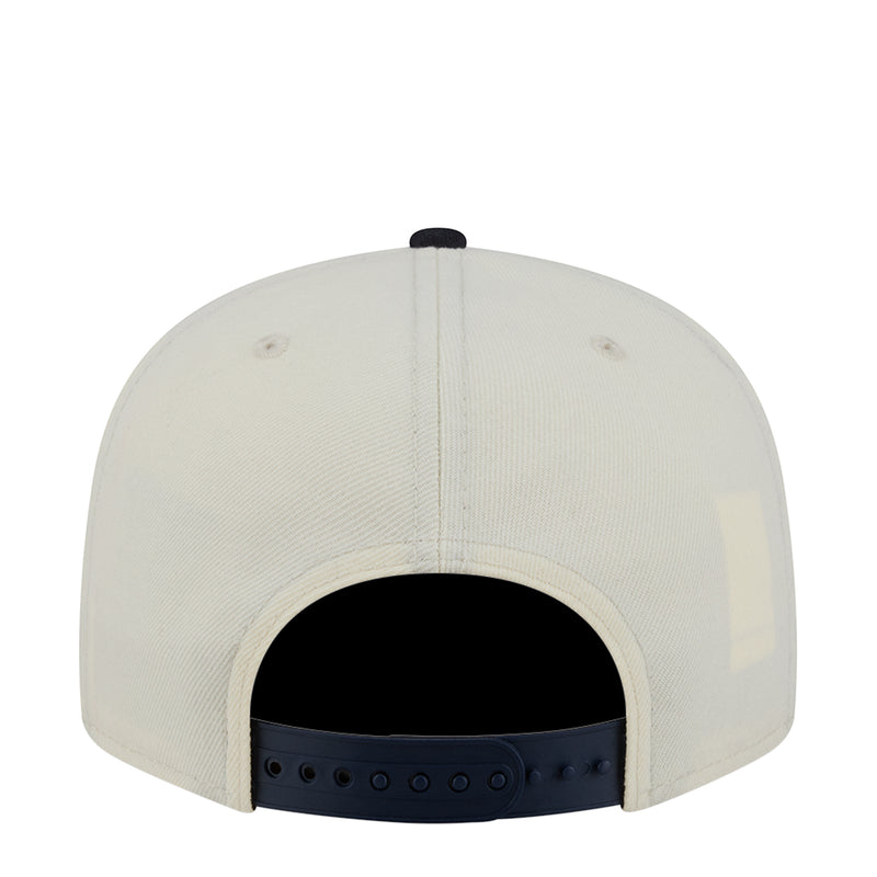 Two-tone baseball cap back view: white crown with black opening and navy strap