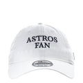 White baseball cap with "ASTROS FAN" text on the front panel